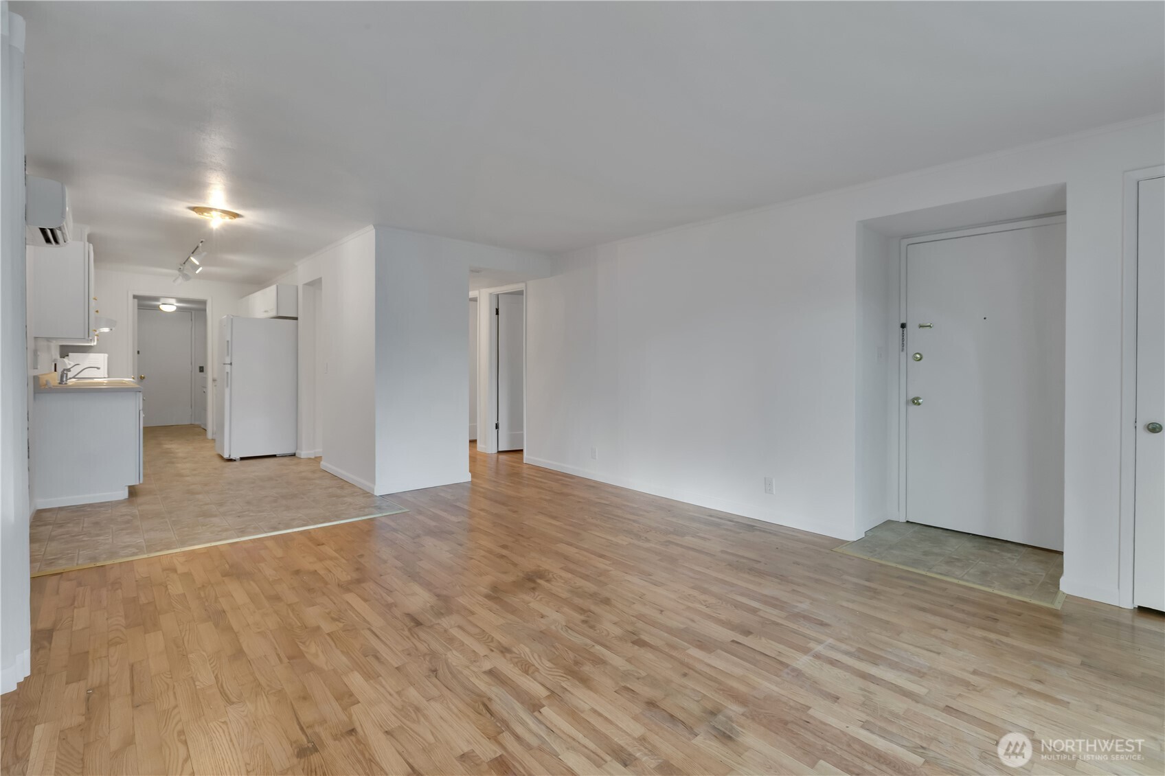 10421 2nd Place Southwest Seattle, WA 98146 - Photo 7 of 28 a view of an empty room with wooden floor