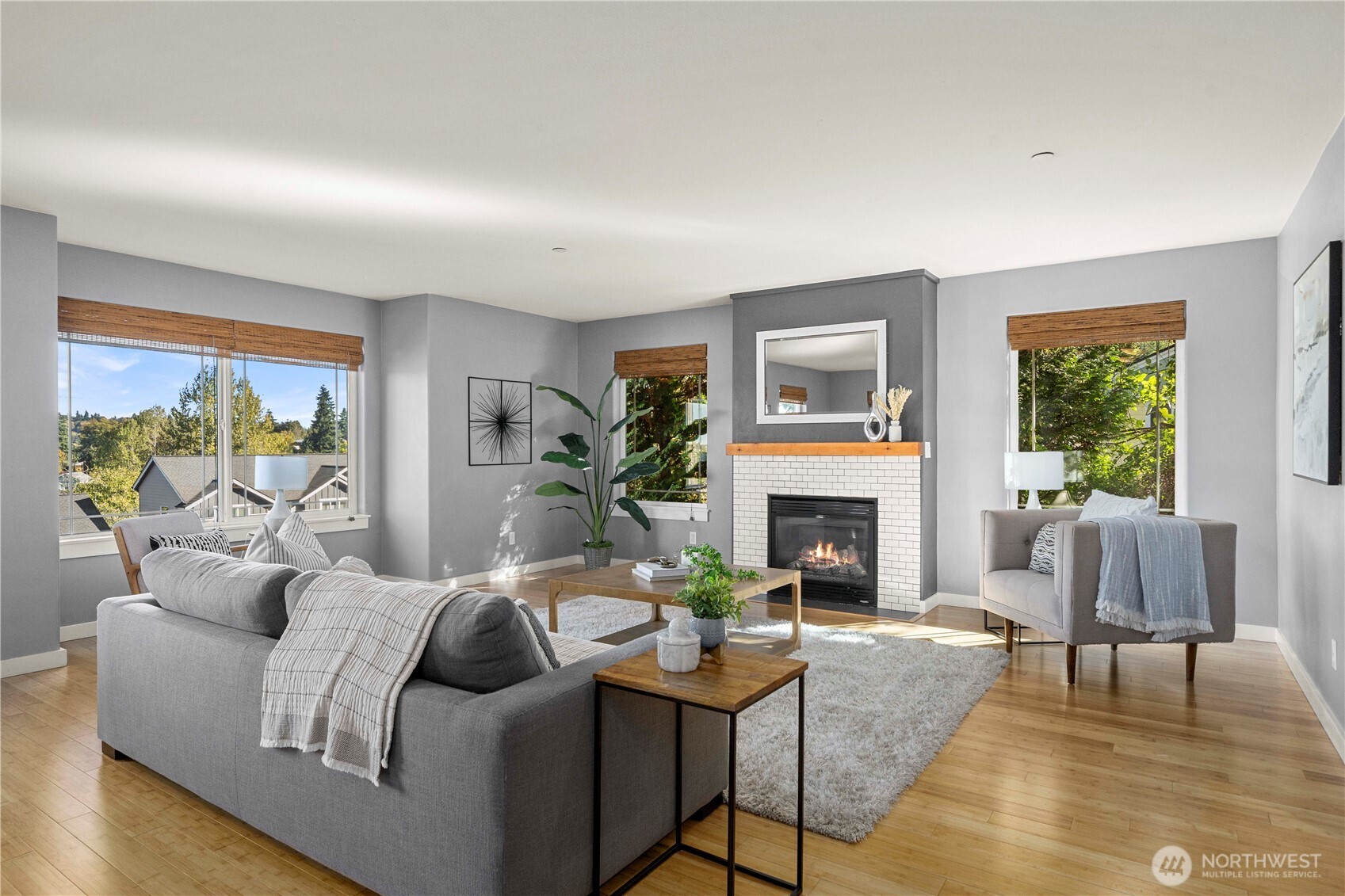 13827 Macadam Road South Tukwila, WA 98168 - Photo 3 of 29 a living room with furniture a fireplace and a large window