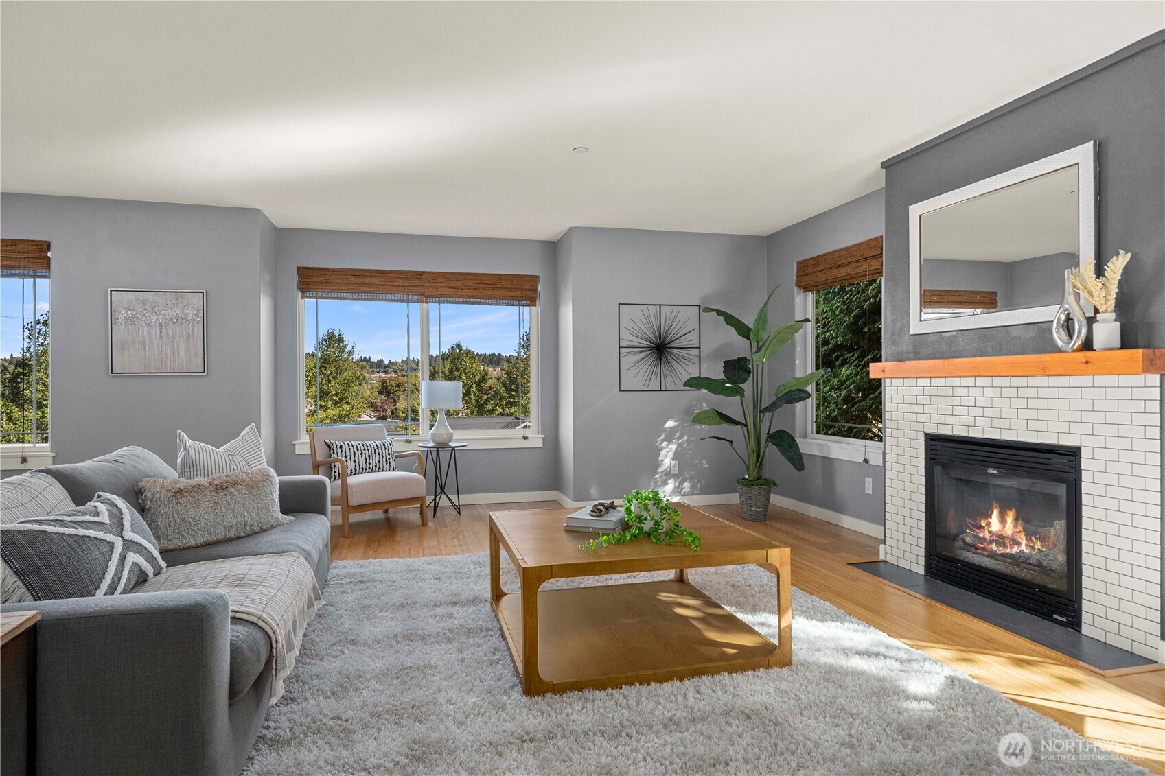 13827 Macadam Road South Tukwila, WA 98168 - Photo 5 of 29 a living room with furniture a large window and a fireplace