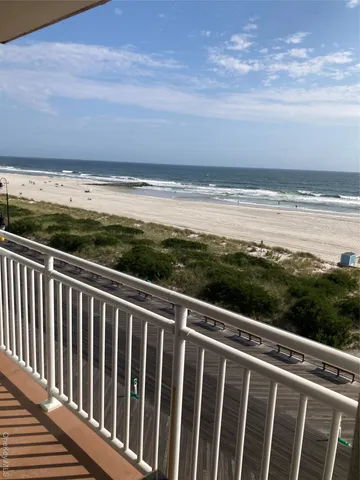 a view of a balcony with an ocean view