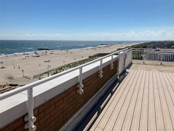 a view of balcony with wooden floor