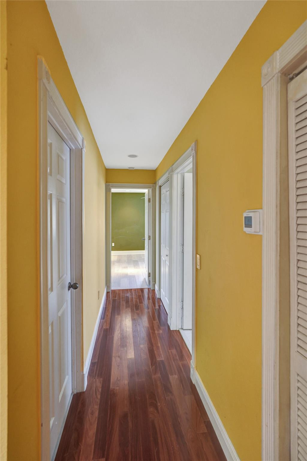 10902 Tamoron Lane Boca Raton, FL 33498 - Photo 42 of 66 a view of a hallway with wooden floor