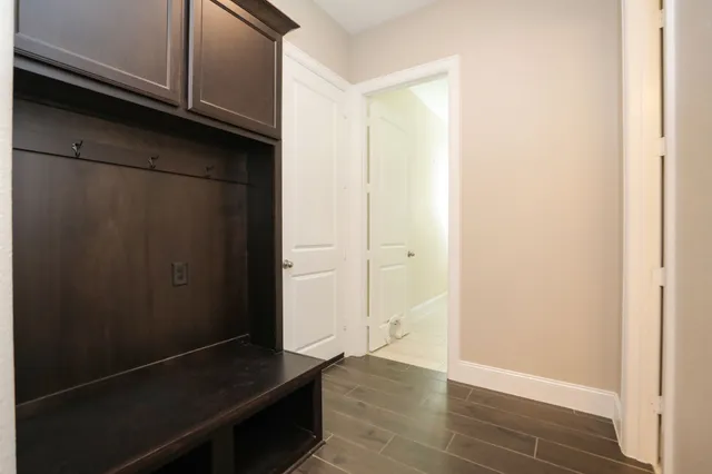 a kitchen with kitchen island stainless steel appliances a sink counter top space and cabinets