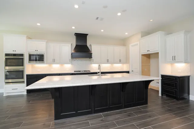 a view of a livingroom with a ceiling fan and window