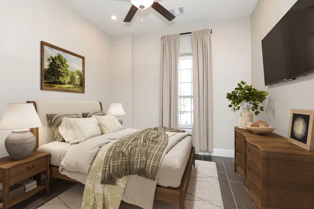a bathroom with a granite countertop sink and a toilet