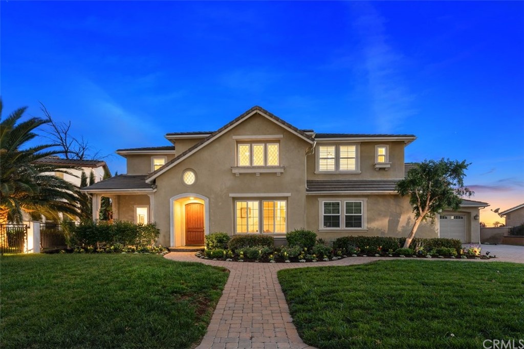13361 Highstone Court Rancho Cucamonga, CA 91739 - Photo 1 of 1 a front view of a house with a yard