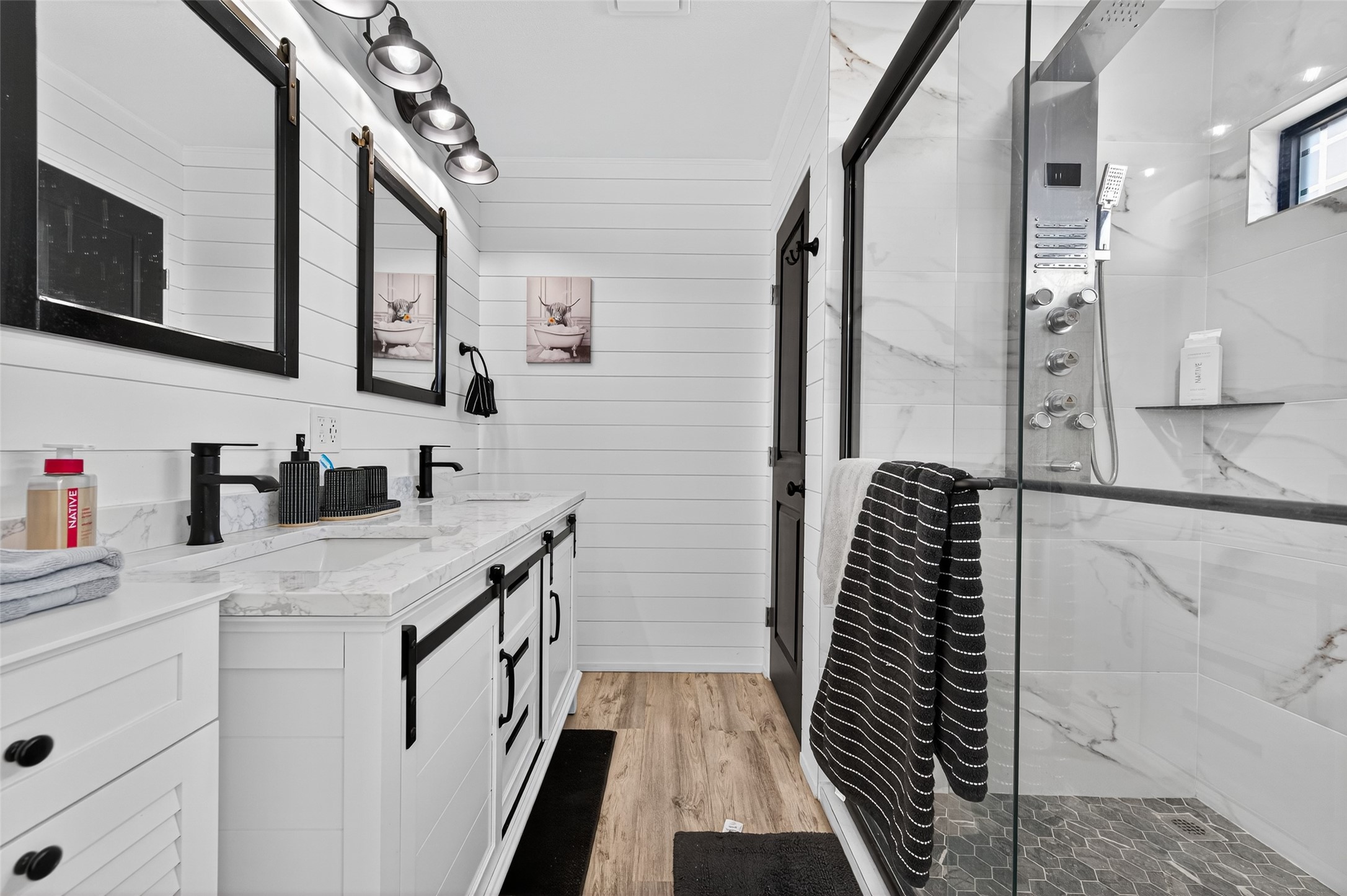 805 Williams Road East Bernard, TX 77435 - Photo 26 of 47 Bathroom featuring dual vanities, stylish fixtures, and a custom walk-in shower with modern tile accents.