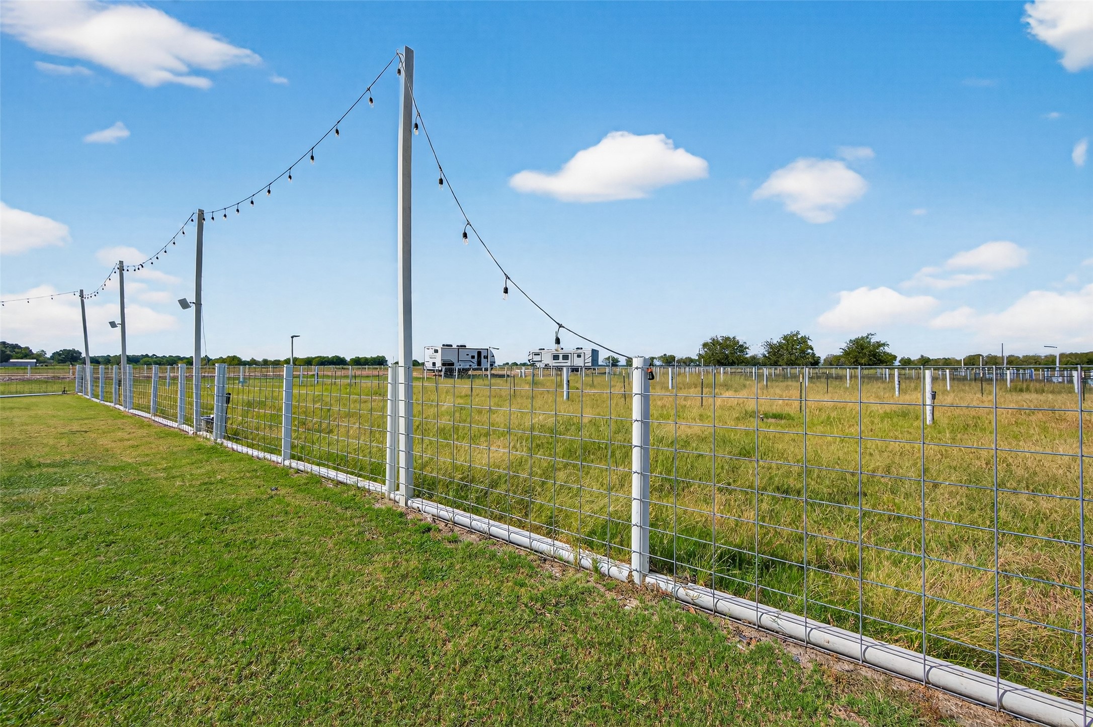 805 Williams Road East Bernard, TX 77435 - Photo 40 of 47 Fenced pasture area with open views and wide-open space—ideal for livestock, gardening, or enjoying the rural setting.