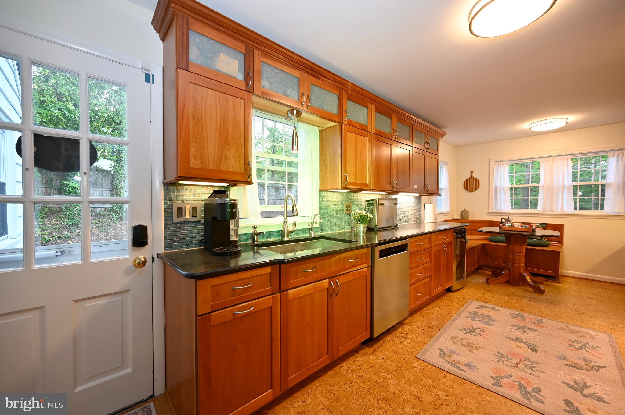 572 Cricket Lane Wayne, PA 19087 - Photo 11 of 37 a kitchen with stainless steel appliances kitchen island granite countertop a sink and cabinets