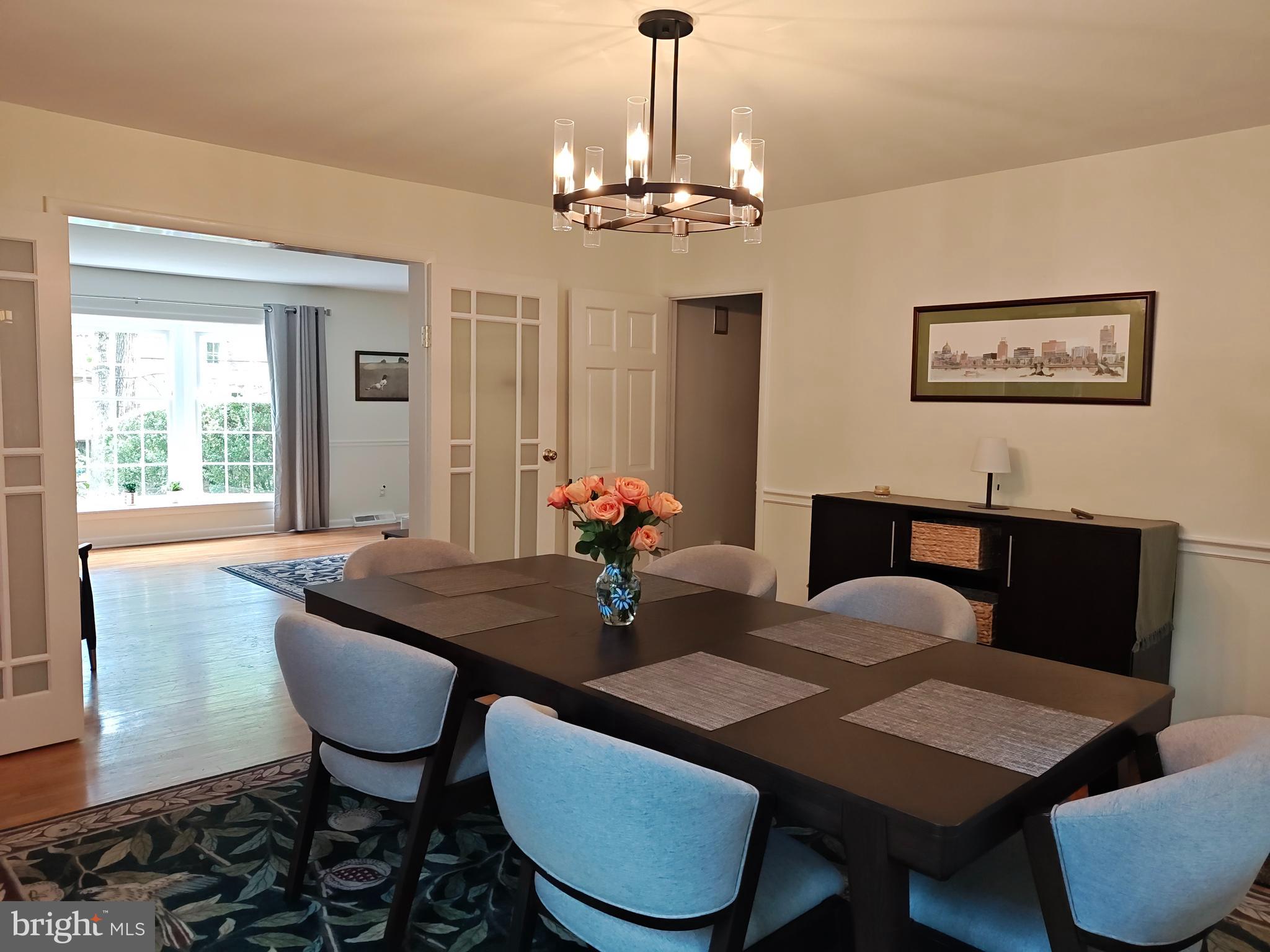572 Cricket Lane Wayne, PA 19087 - Photo 18 of 37 a view of a dining room with furniture wooden floor and a chandelier
