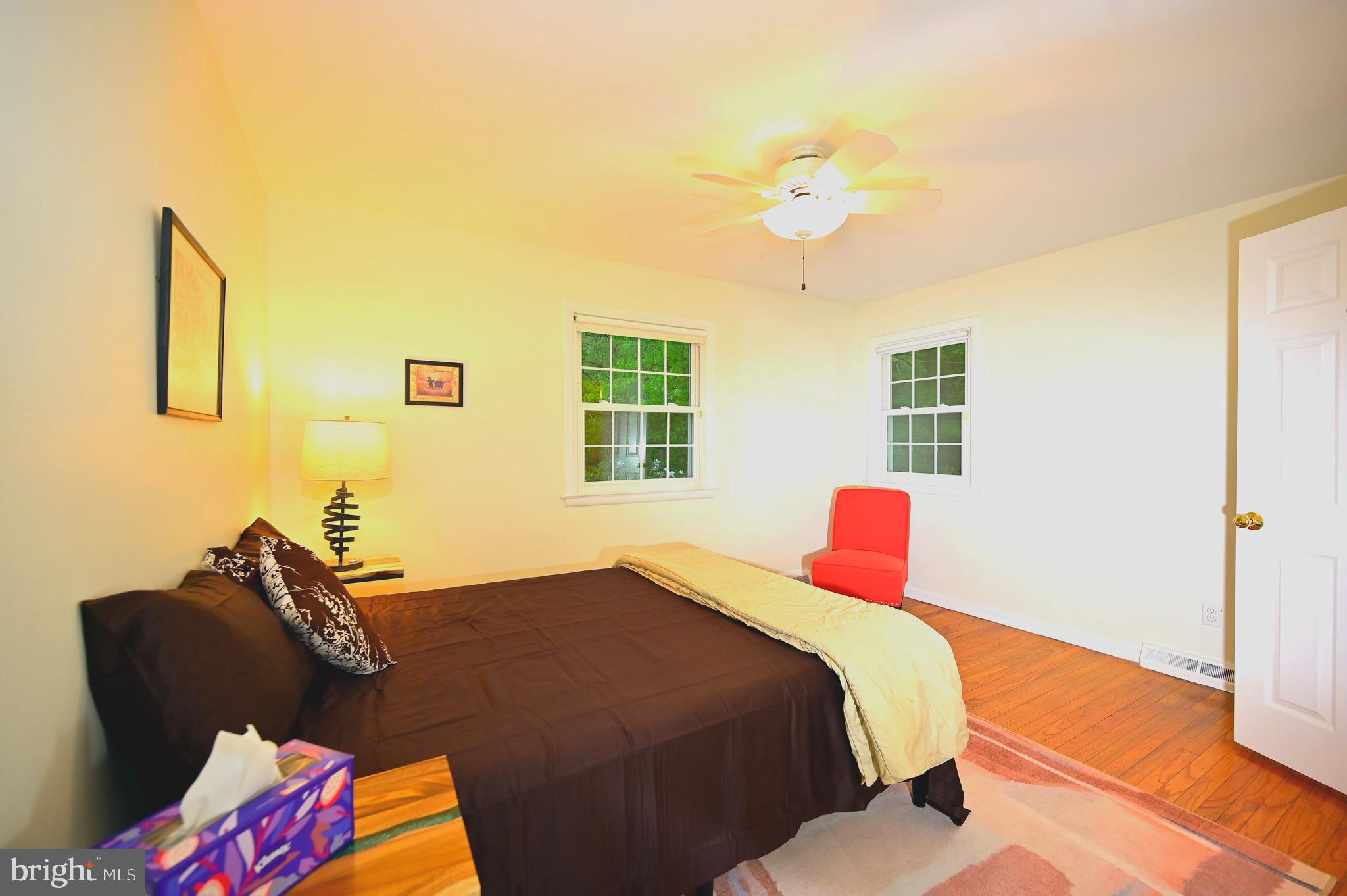 572 Cricket Lane Wayne, PA 19087 - Photo 24 of 37 a bedroom with a bed and wooden floor