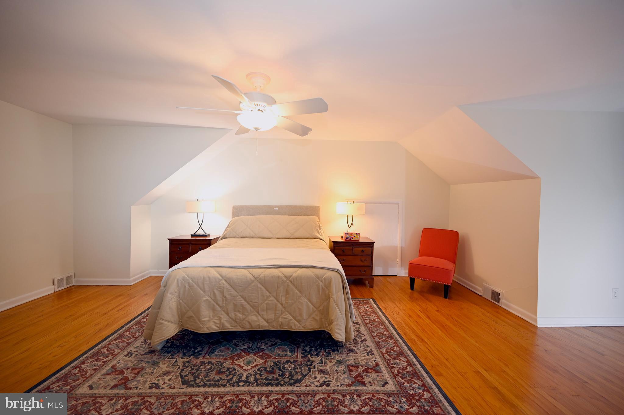 572 Cricket Lane Wayne, PA 19087 - Photo 28 of 37 a bedroom with a bed and wooden floor