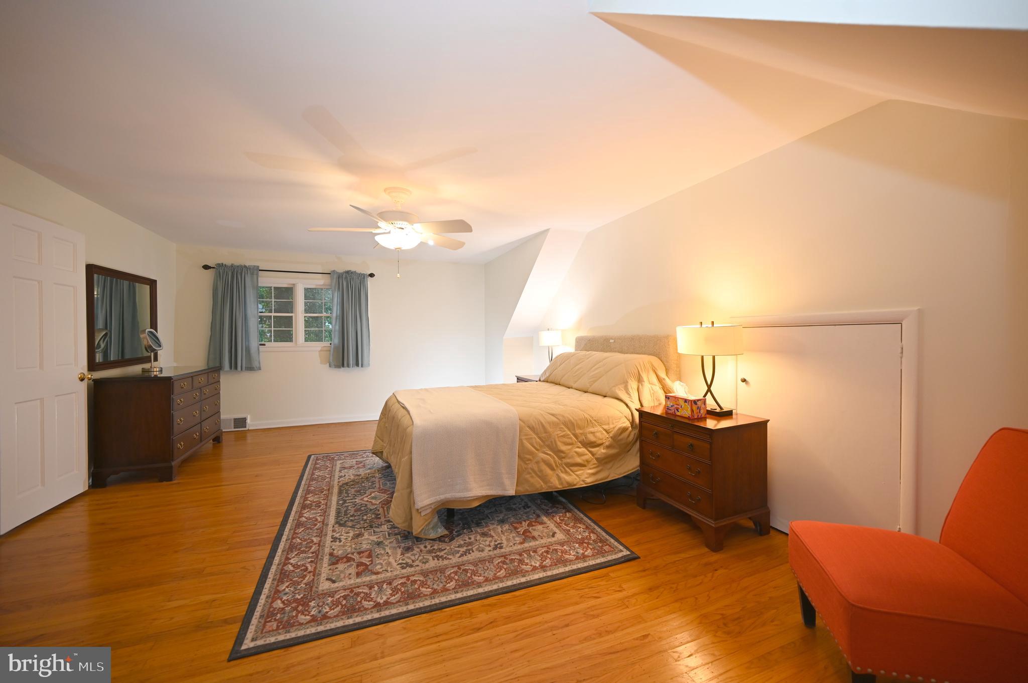 572 Cricket Lane Wayne, PA 19087 - Photo 29 of 37 a bedroom with a bed and wooden floor