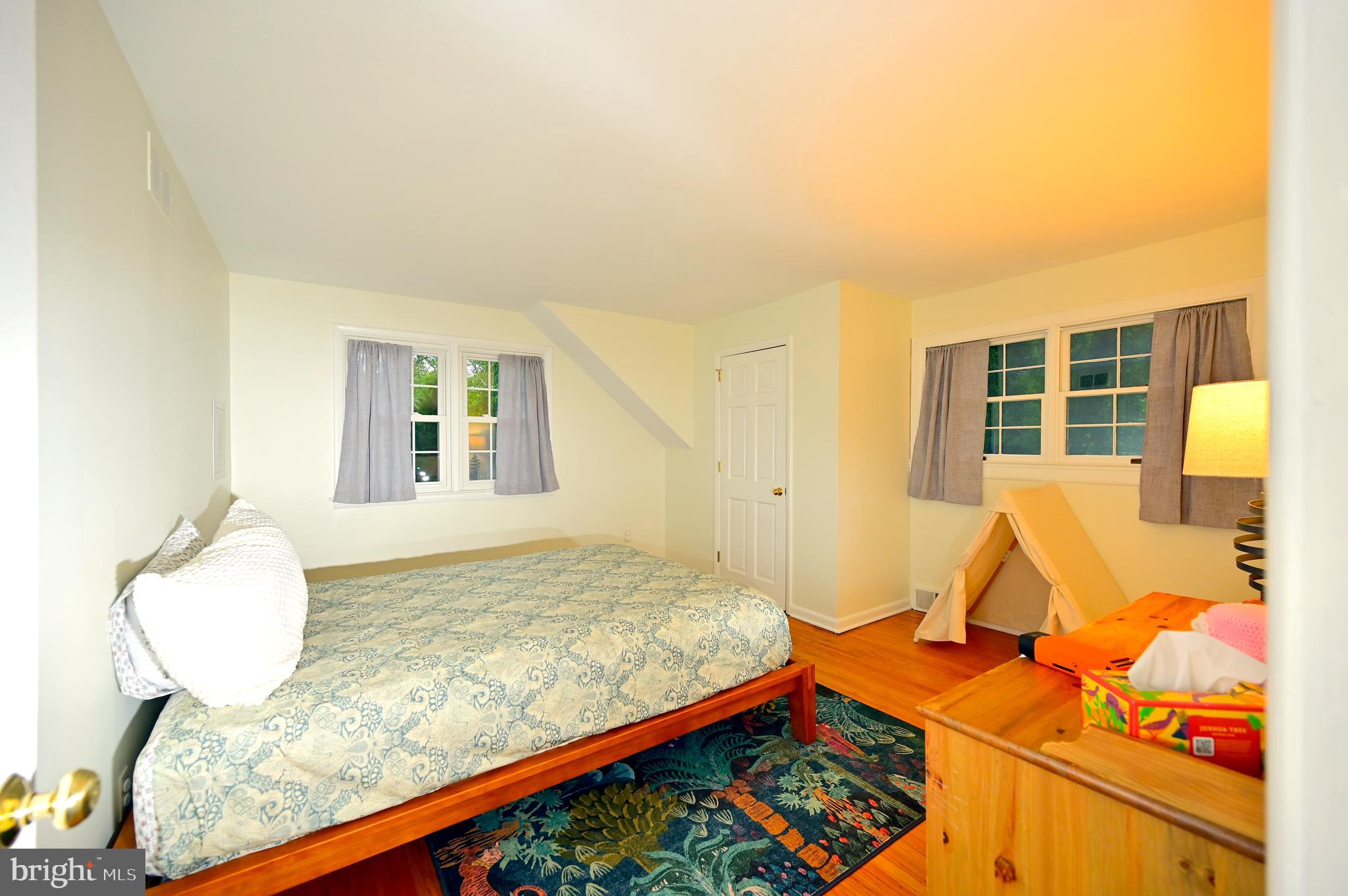 572 Cricket Lane Wayne, PA 19087 - Photo 30 of 37 a bedroom with a bed and wooden floor