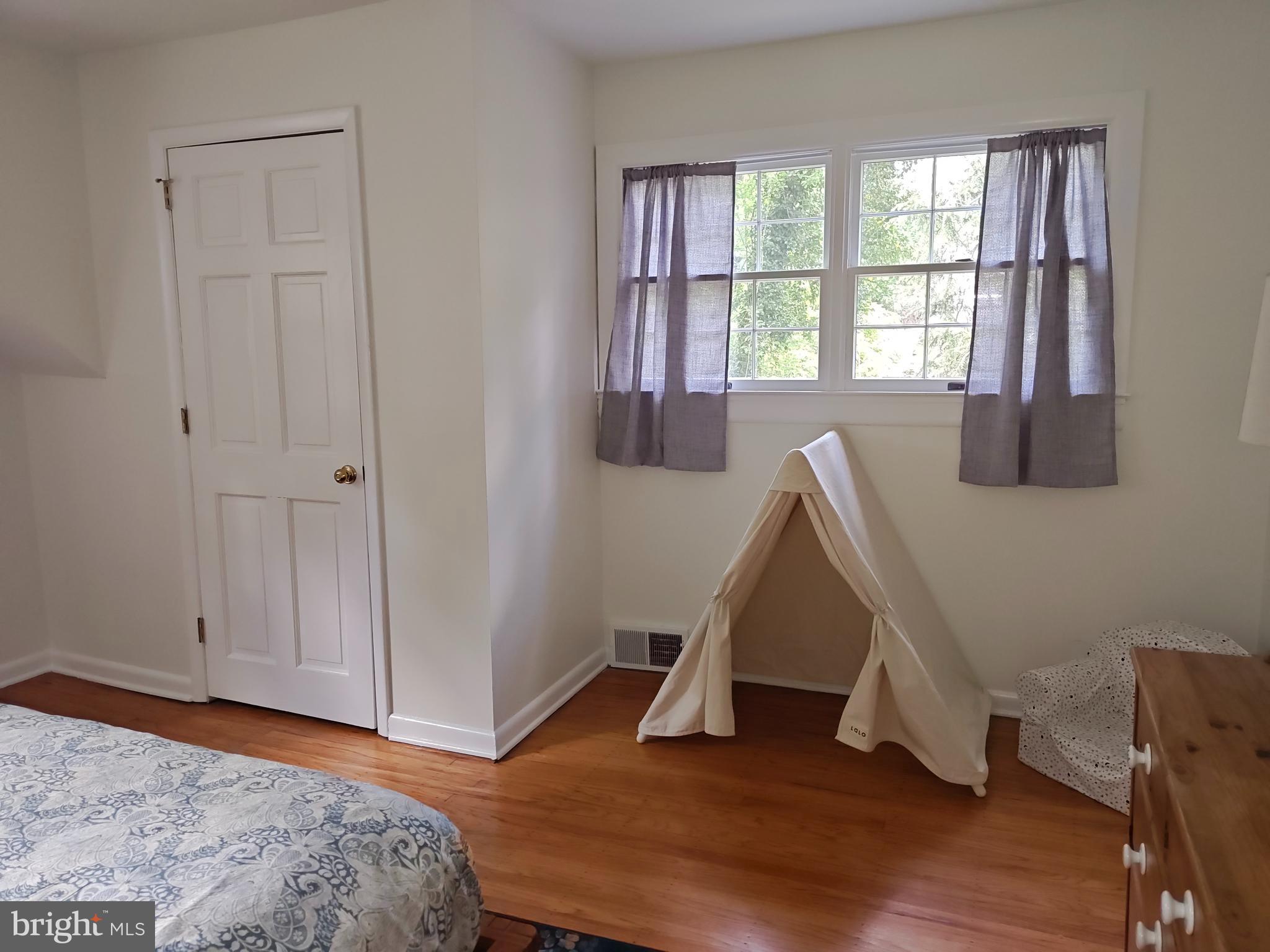572 Cricket Lane Wayne, PA 19087 - Photo 31 of 37 a view of a room with wooden floor and window