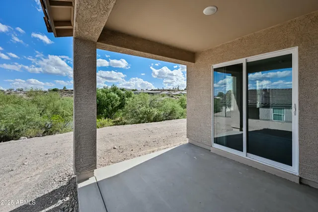 a view of a room with porch and wooden floor