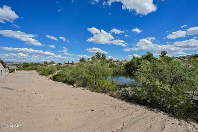 a sunset view with a lake