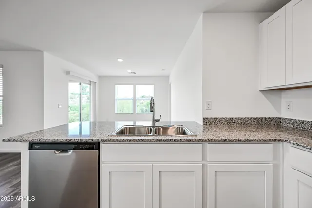 a kitchen with a sink and a window