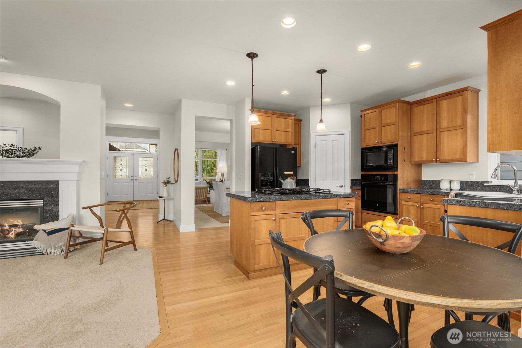 16101 Southeast 251st Street Covington, WA 98042 - Photo 11 of 32 a large kitchen with a table and chairs