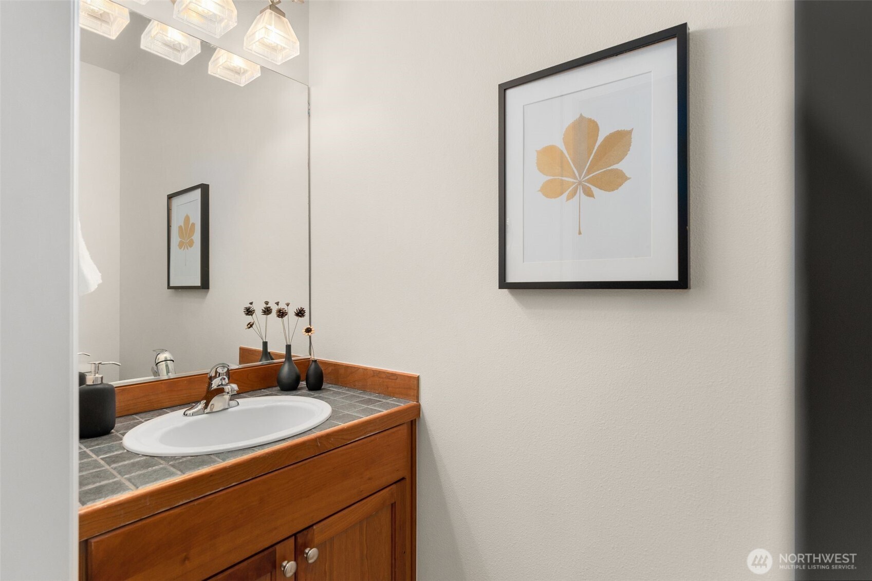 16101 Southeast 251st Street Covington, WA 98042 - Photo 16 of 32 a bathroom with a sink and a mirror