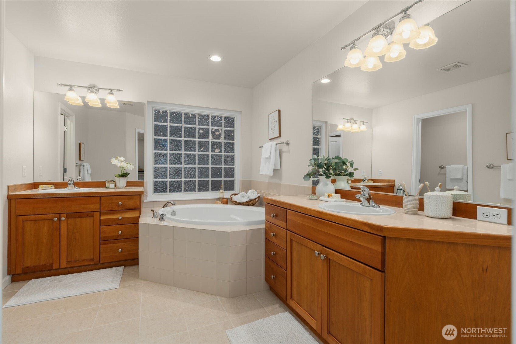 16101 Southeast 251st Street Covington, WA 98042 - Photo 21 of 32 a bathroom with a tub sink and mirror
