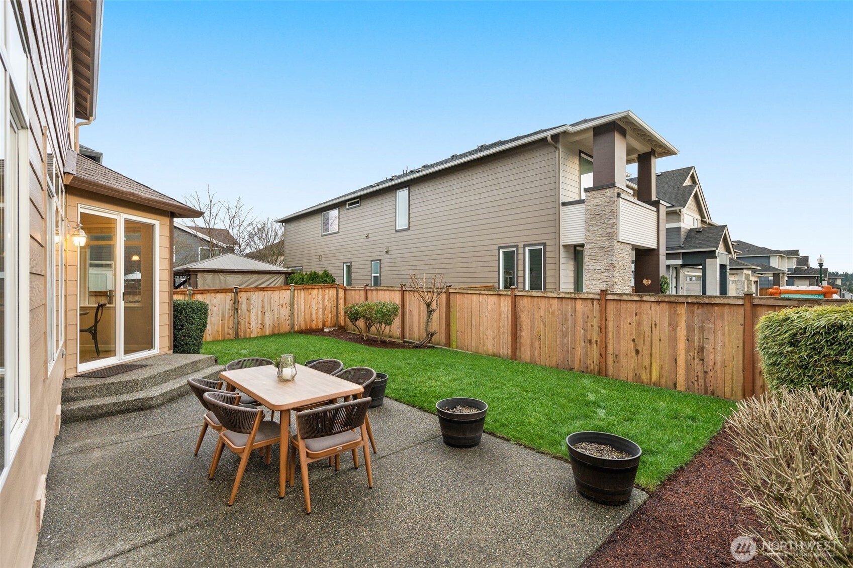 16101 Southeast 251st Street Covington, WA 98042 - Photo 27 of 32 a view of a patio with table and chairs and wooden fence