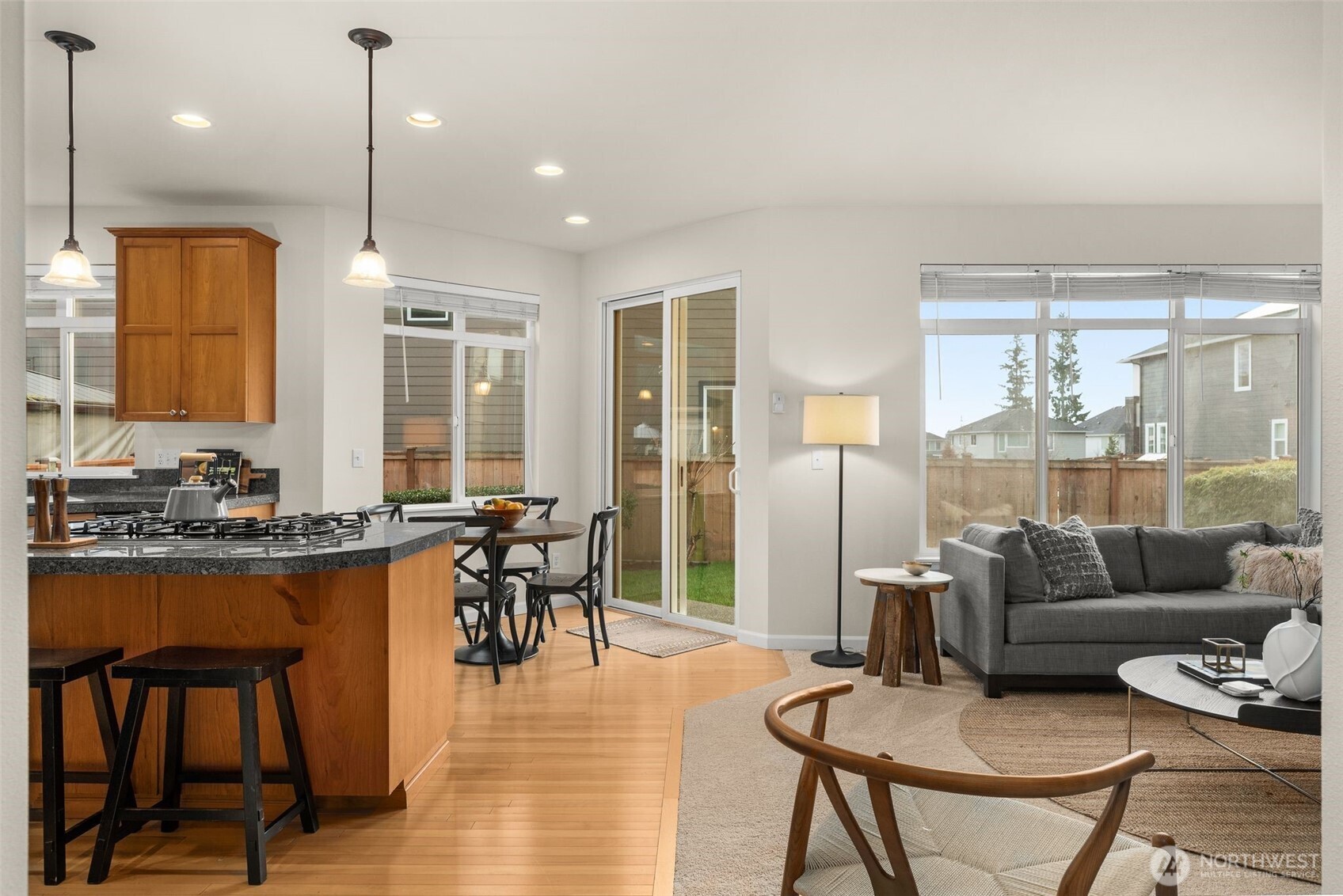16101 Southeast 251st Street Covington, WA 98042 - Photo 9 of 32 a dining room with furniture a chandelier and wooden floor