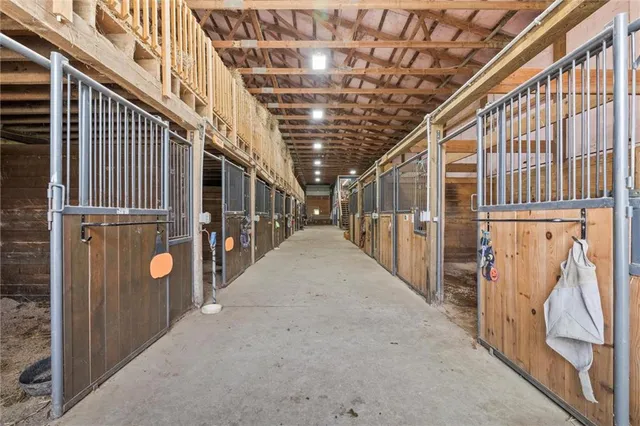 a view of a room with lots of gym equipment