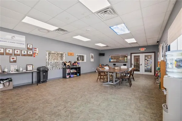 a view of a livingroom with furniture and a garage