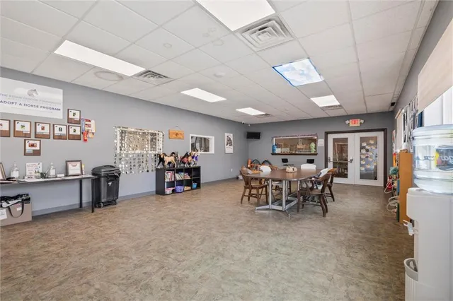 a view of a livingroom with furniture and a garage