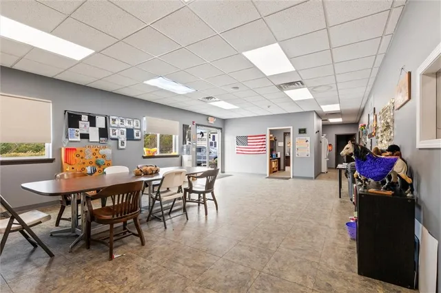 a living room with lots of furniture and white walls