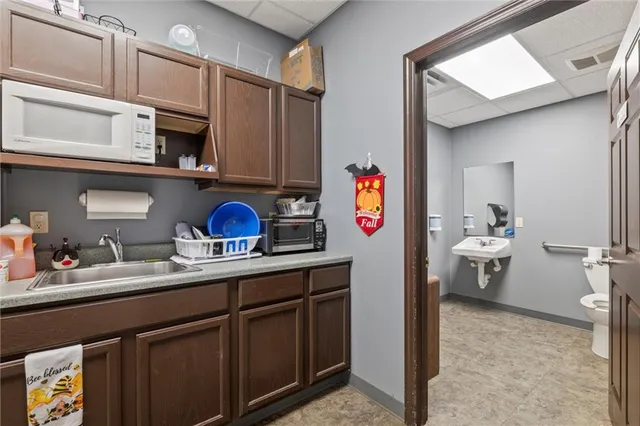 a view of a livingroom with furniture and a window