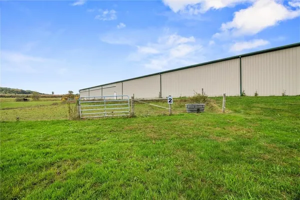 a view of a swimming pool with a yard