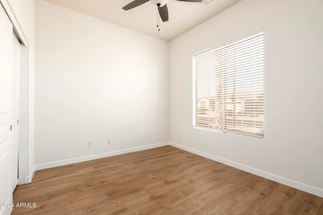 a bathroom with a granite countertop sink toilet a large mirror a bathtub and shower