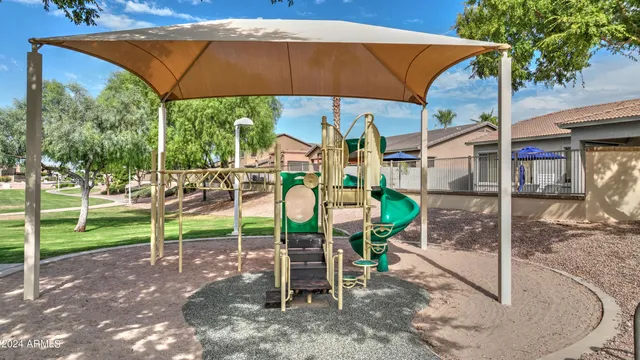 a view of a garden with a building in the background