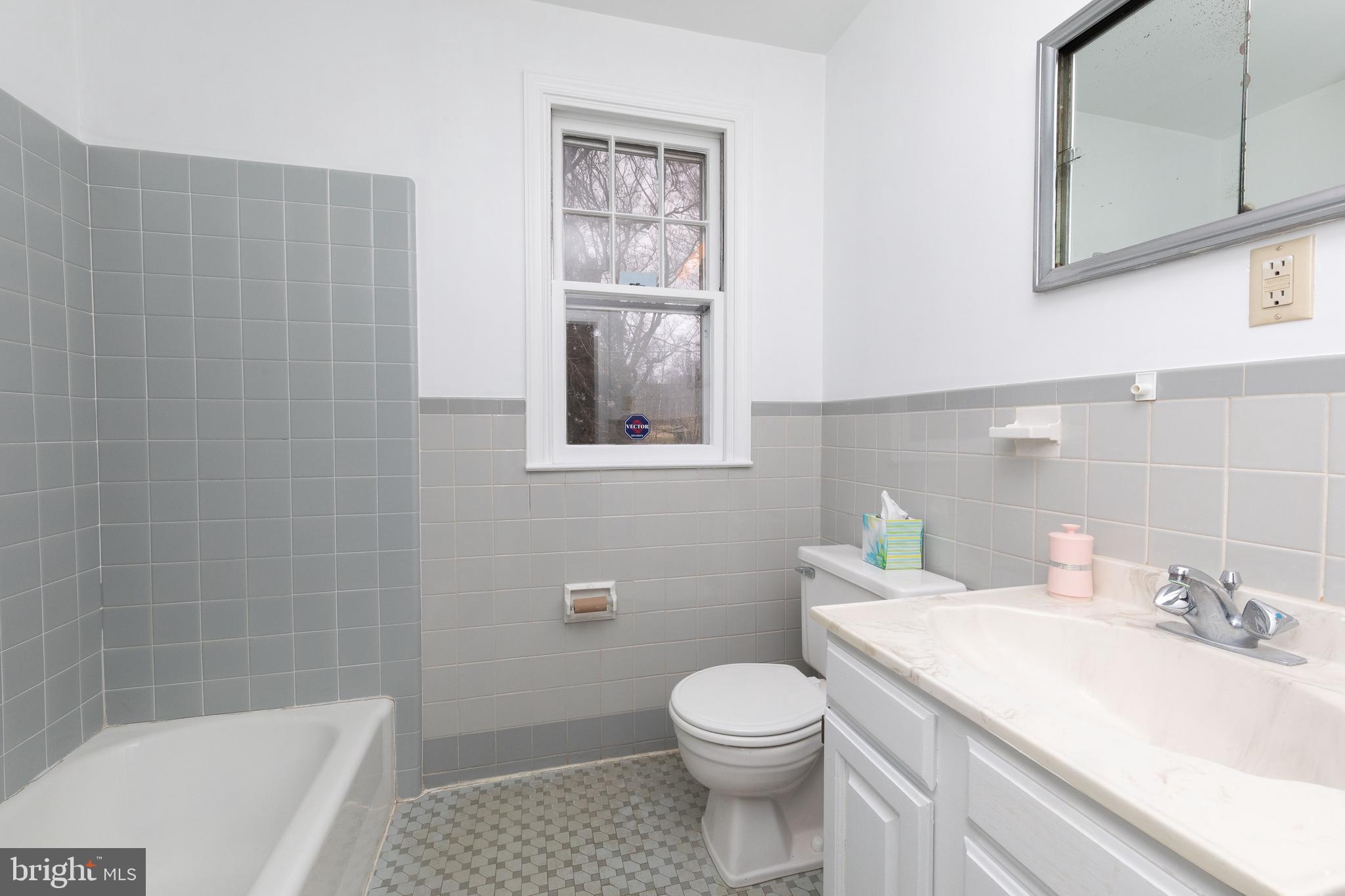 615 Arlingham Road Flourtown, PA 19031 - Photo 12 of 25 a bathroom with a sink a toilet and shower