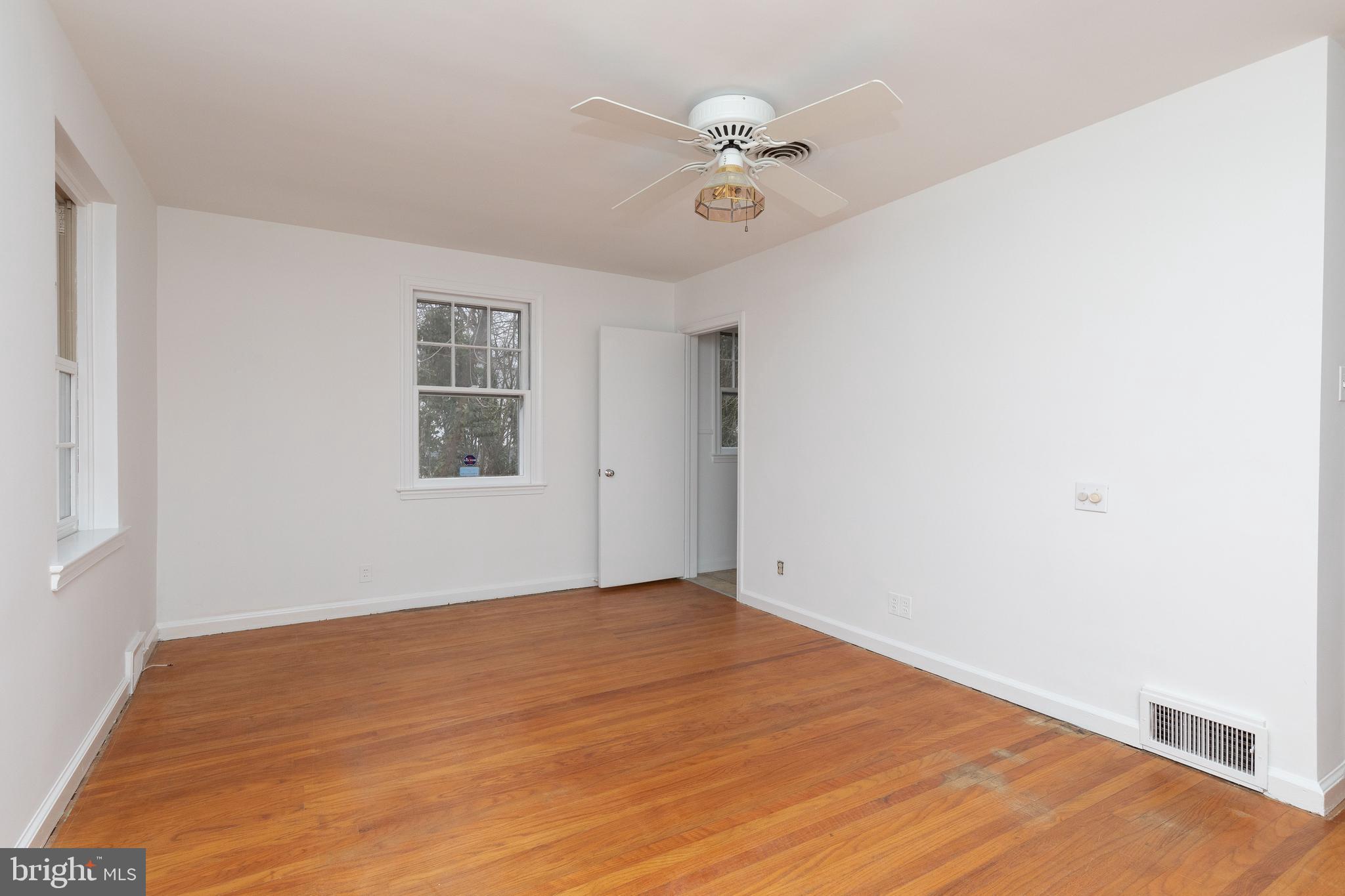 615 Arlingham Road Flourtown, PA 19031 - Photo 17 of 25 wooden floor in an empty room with a window