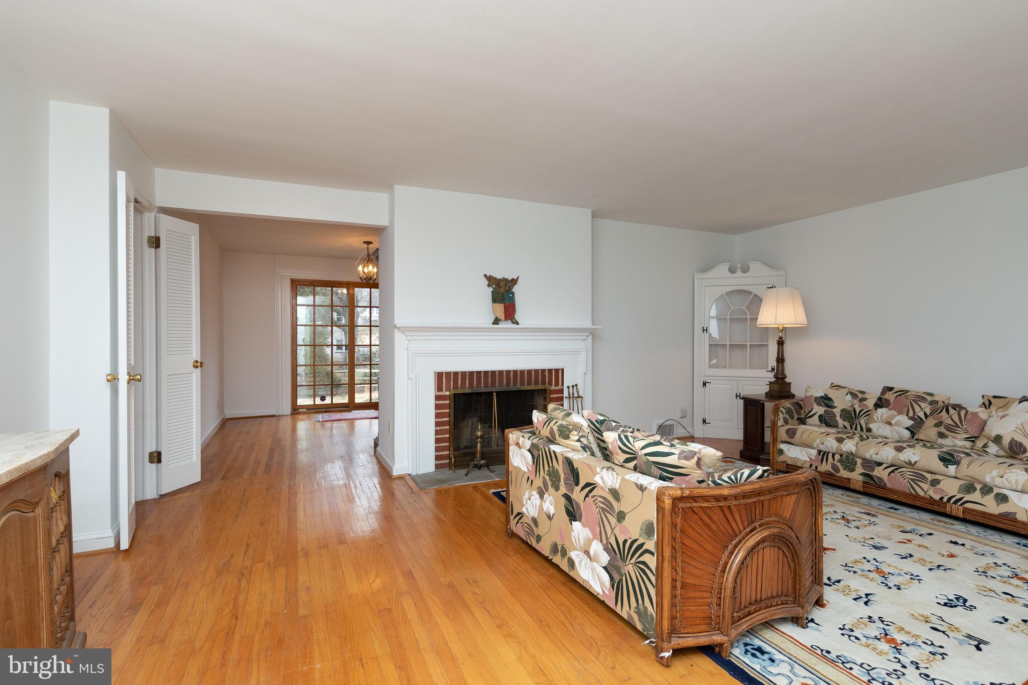 615 Arlingham Road Flourtown, PA 19031 - Photo 2 of 25 a living room with furniture and a fireplace
