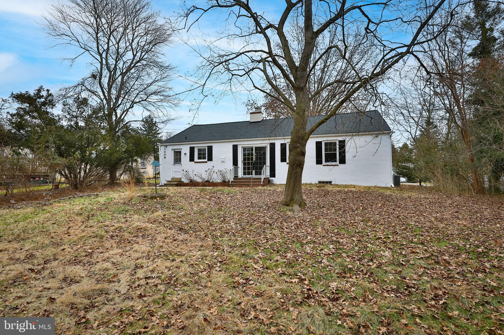 615 Arlingham Road Flourtown, PA 19031 - Photo 25 of 25 a house with trees in front of it