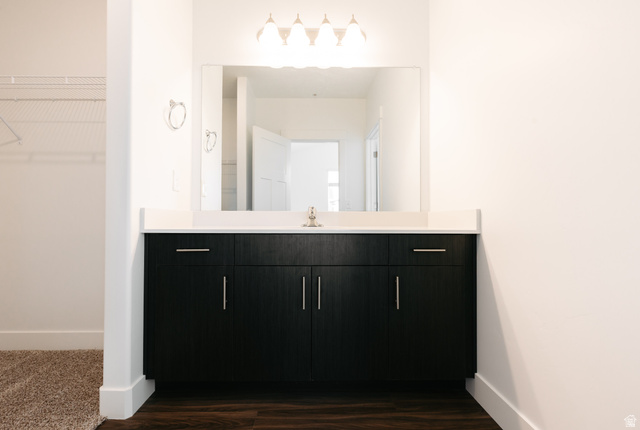 4655 South 720 West, Unit I303 Mapleton, UT 84664 - Photo 5 of 15 Bathroom with a spacious closet, vanity, and dark wood-style flooring