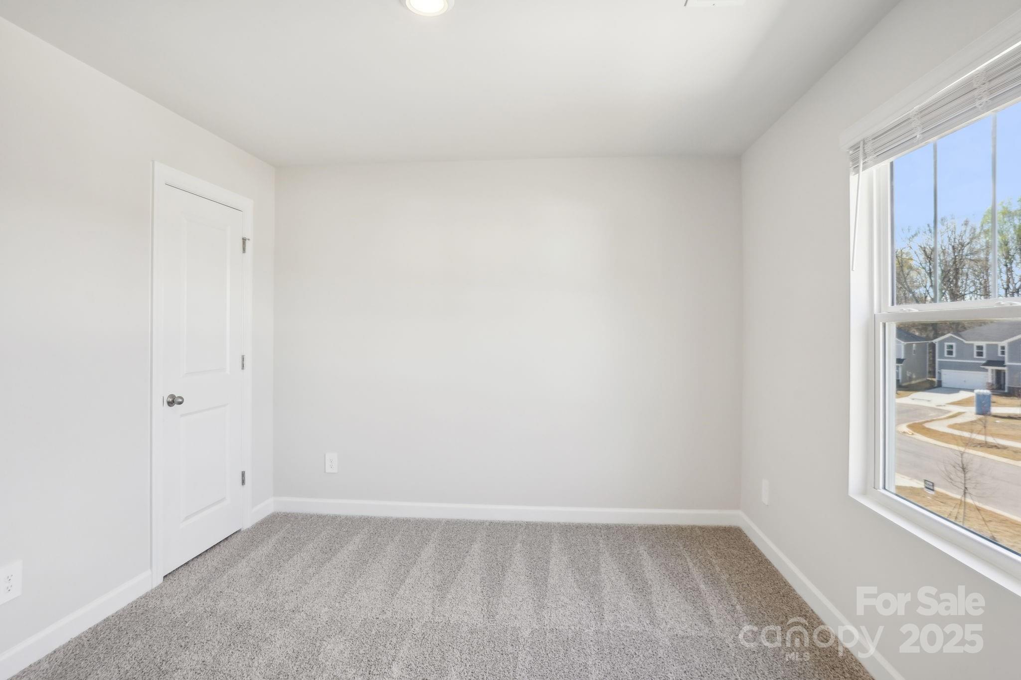 1249 30th St Lane Northeast Conover, NC 28613 - Photo 11 of 23 a view of an empty room and window