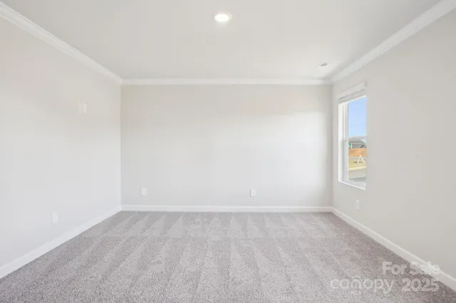 an empty room with a empty space and a window