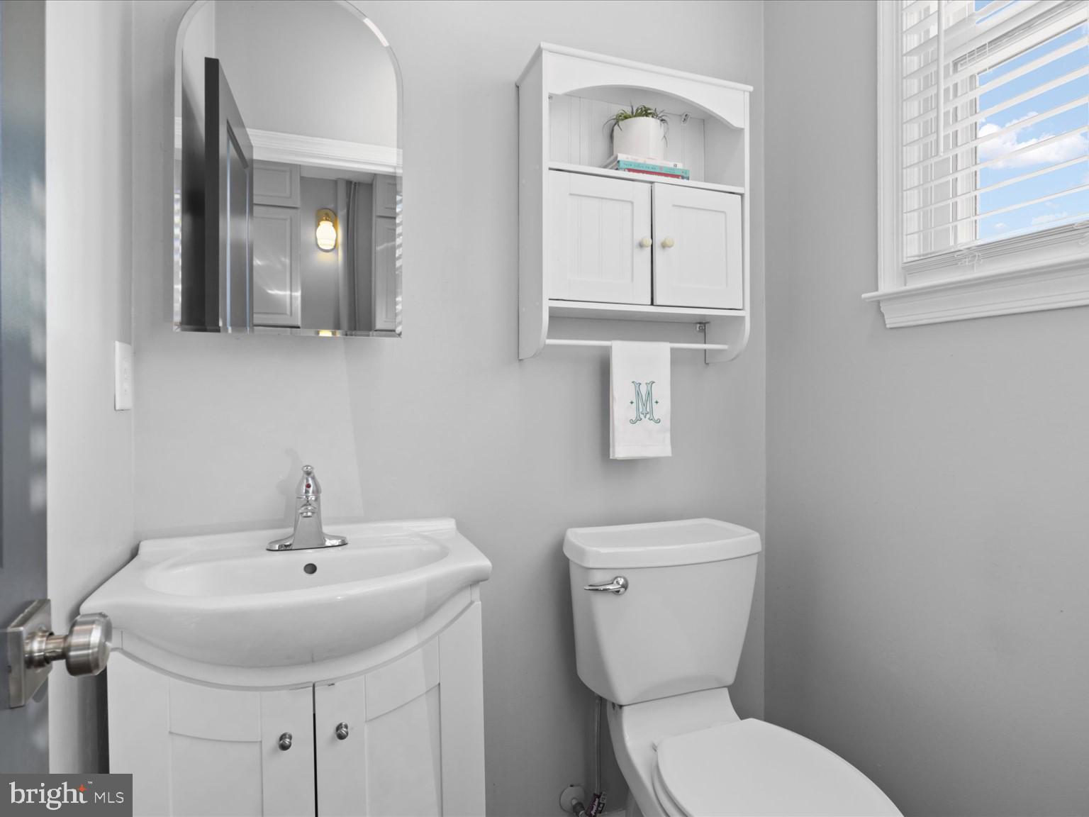 9419 Ramey Road Marshall, VA 20115 - Photo 16 of 35 a bathroom with a toilet sink and mirror