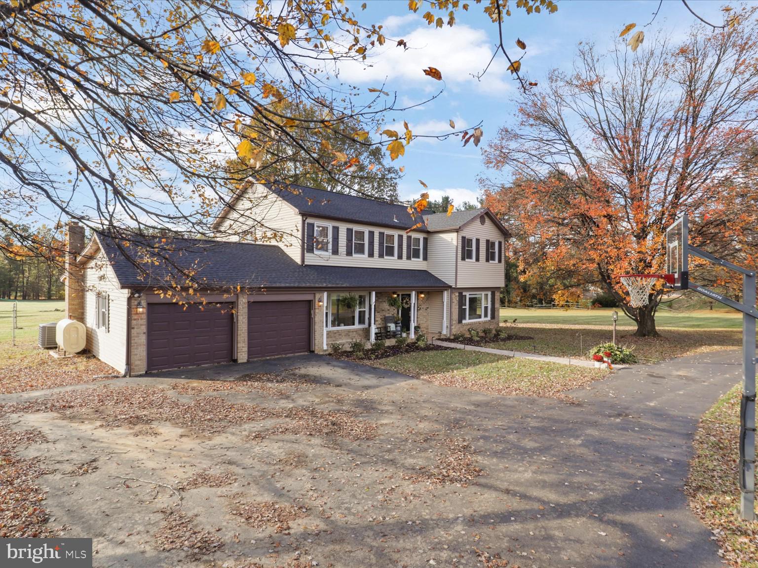 9419 Ramey Road Marshall, VA 20115 - Photo 2 of 35 a view of a house with a big yard and large tree