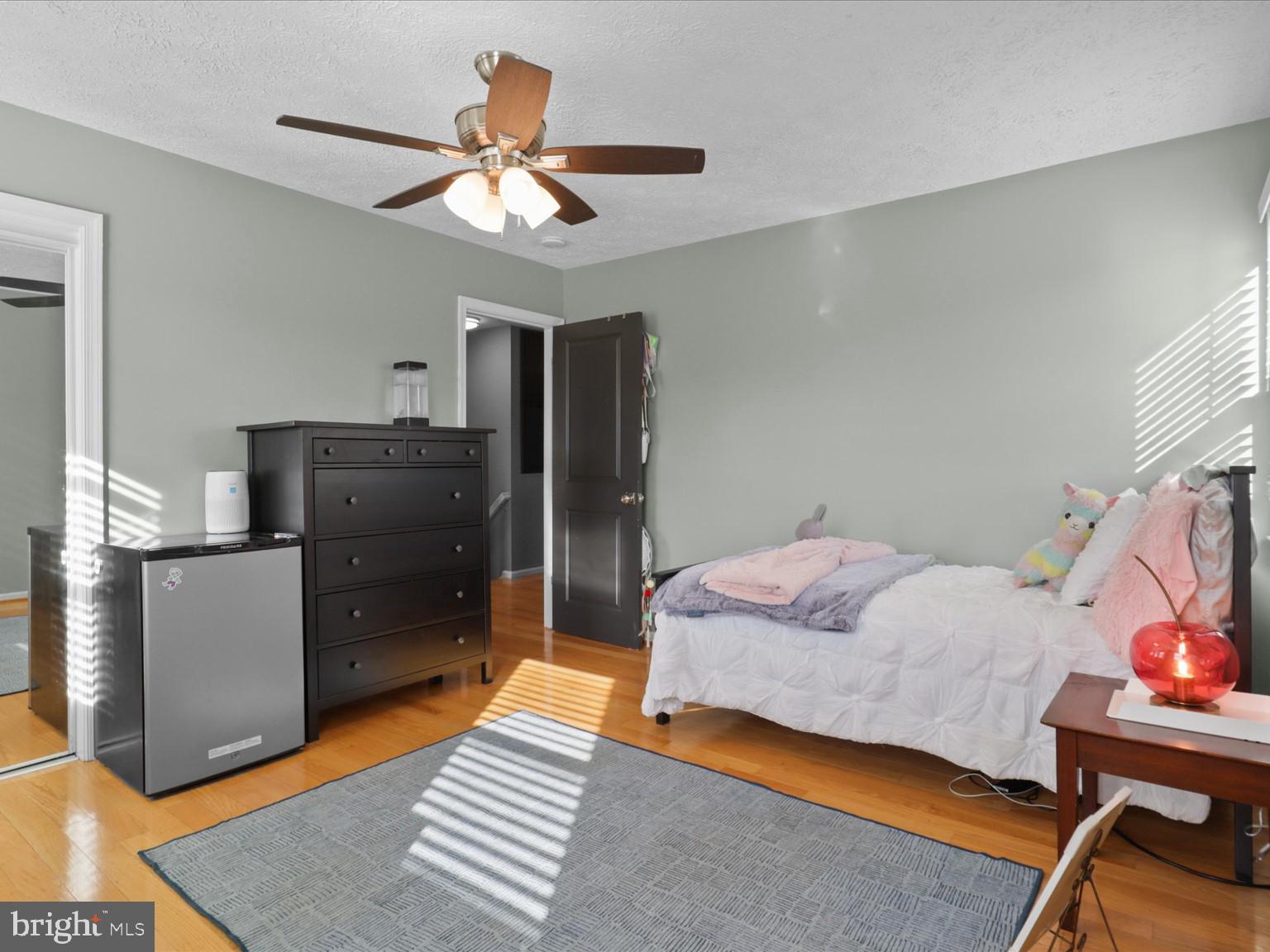 9419 Ramey Road Marshall, VA 20115 - Photo 26 of 35 a bedroom with a bed and a chandelier