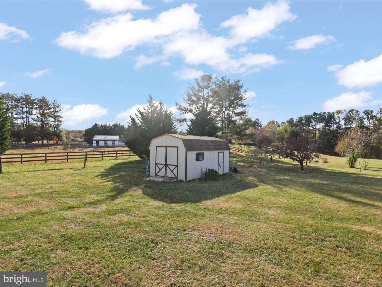9419 Ramey Road Marshall, VA 20115 - Photo 31 of 35 a house view with swimming pool and trees in the background