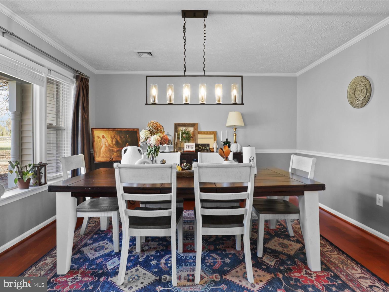 9419 Ramey Road Marshall, VA 20115 - Photo 7 of 35 a dining room with furniture a chandelier and window
