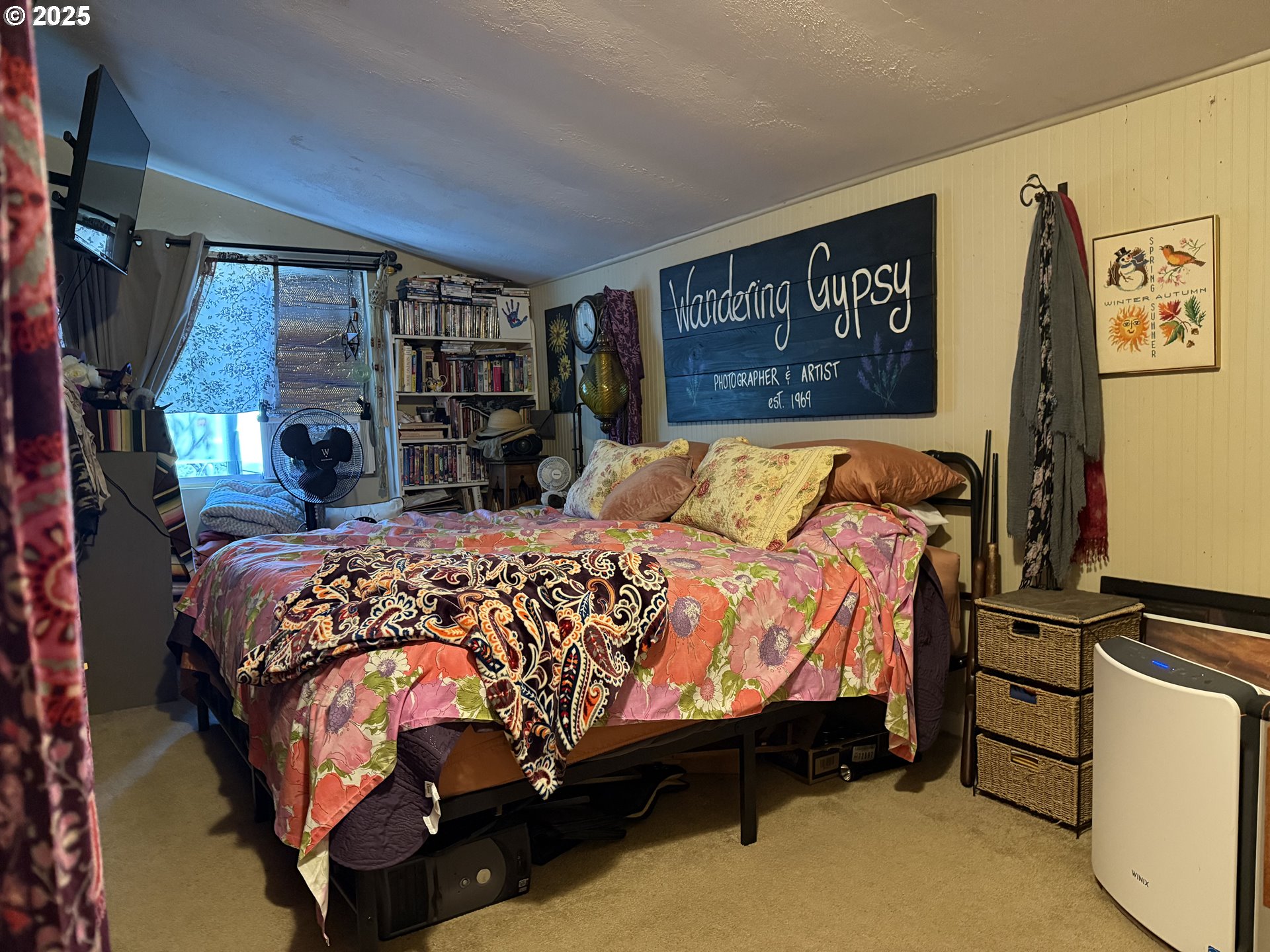 77220 Bar B L Ranch Road Oakridge, OR 97463 - Photo 15 of 24 a large bed sitting in a bedroom next to a bookshelf