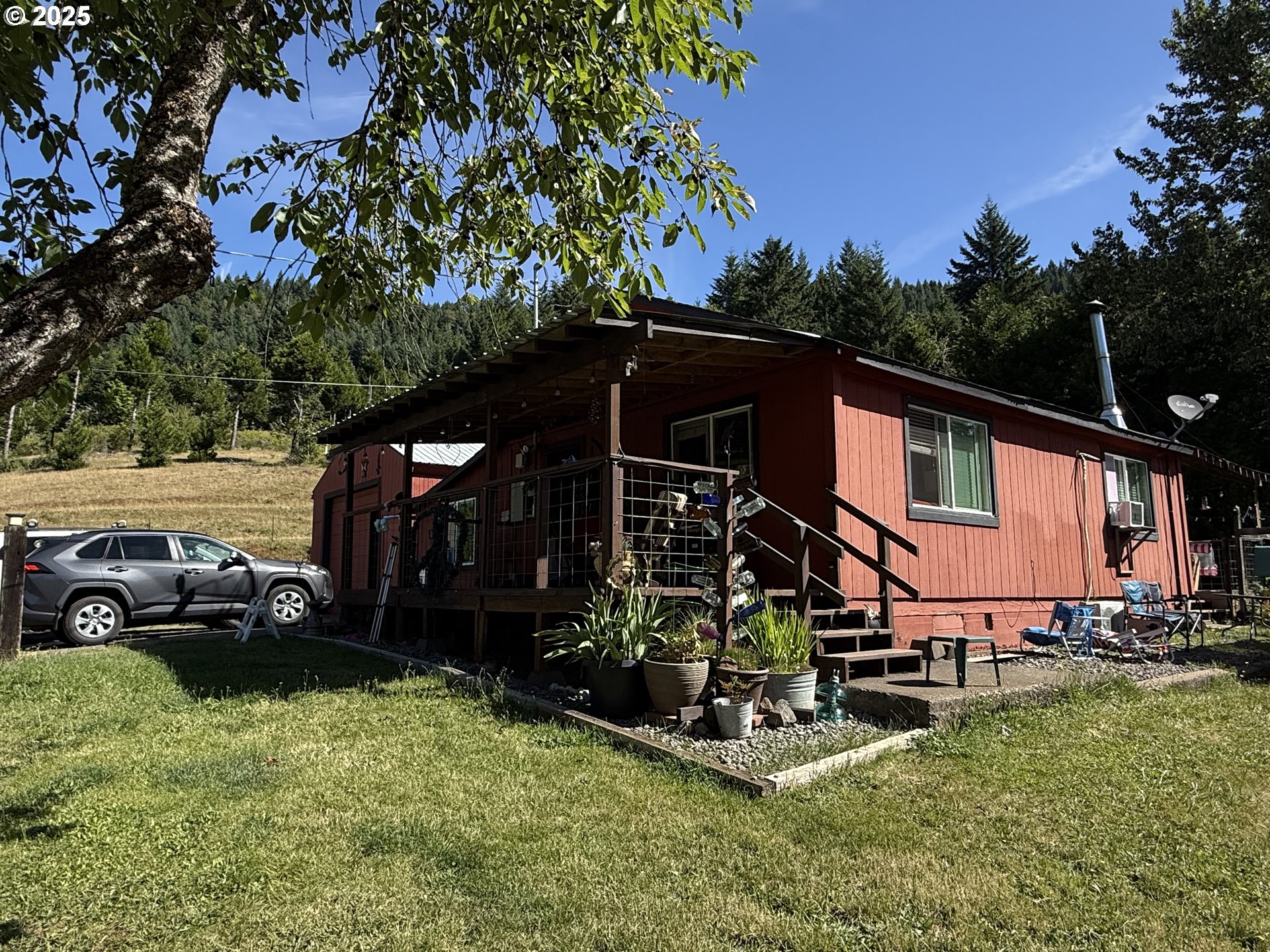 77220 Bar B L Ranch Road Oakridge, OR 97463 - Photo 17 of 24 an outdoor space with lots of trees