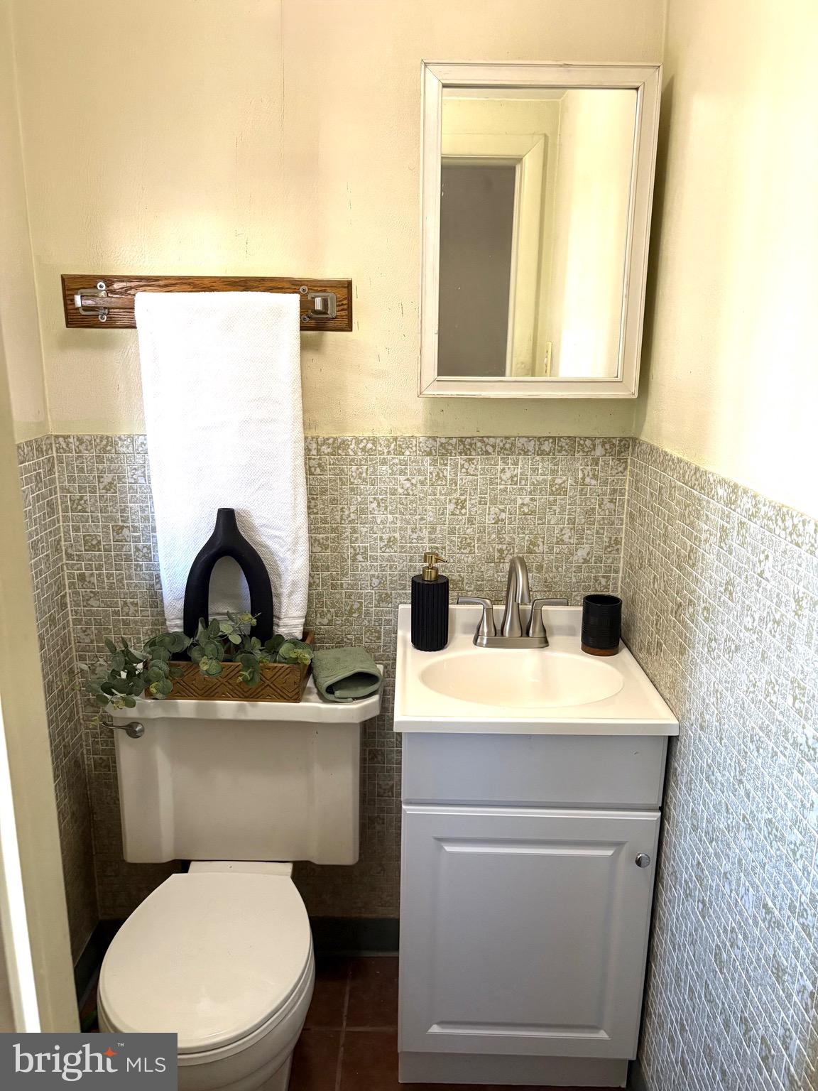 146 Ewingville Road Ewing, NJ 08638 - Photo 3 of 7 a bathroom with a toilet a sink and a mirror